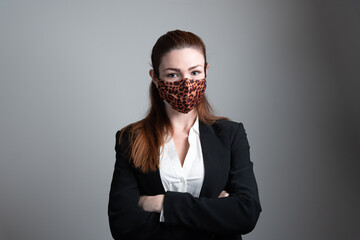 Fototapeta premium Pretty young business woman wearing protective mask. 