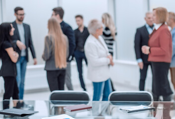 Friendly colleagues consulting after working meeting