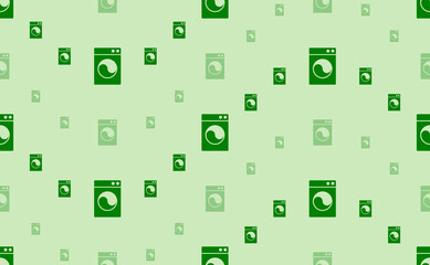 Seamless pattern of large and small green washer symbols. The elements are arranged in a wavy. Vector illustration on light green background