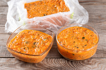 Frozen sauce in a container on a table