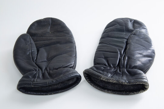 Black Leather Mittens For Winter On A White Background.