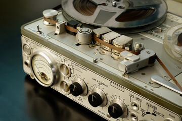 Old vintage reel-to-reel player. Tape recorder with spools. Bobbin tape recorder.
