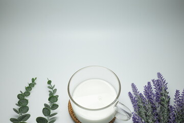 Glass of milk on a white background