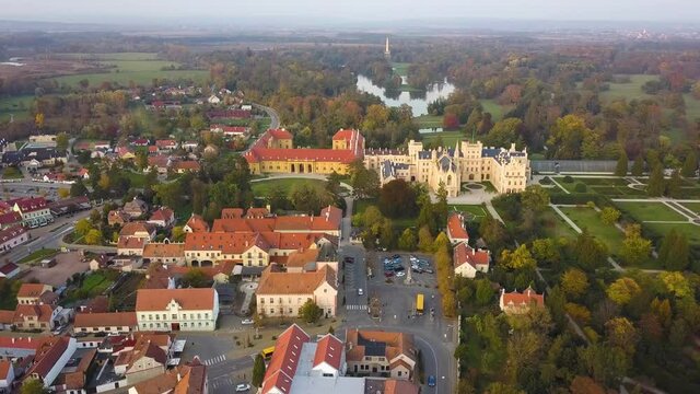 Aerial view of small town and green gardens in Lednice castle Chateau yard in Moravia, Czech Republic. UNESCO World Heritage Site.