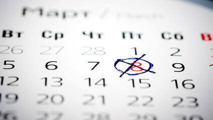 March on the calendar with a cross, the concept of International Women's Day