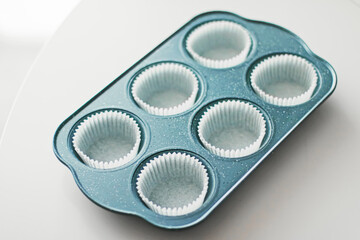 Chocolate muffin or cupcake batter in a pan ready to bake, homemade comfort food recipe