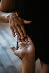 Obraz na płótnie Canvas massage of female hands. oil on hands. vertical