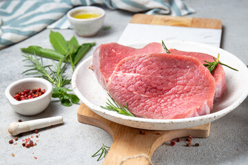 Raw beef steak. Sirloin medallions steaks on white plate