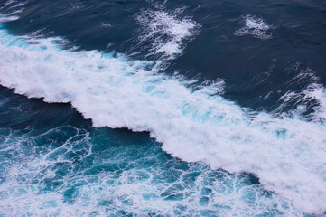 Sea surface background with waves and foam