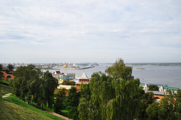 View, panorama from a high bank to the confluence of two rivers. Summer day.