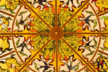 Celling glass art colorful design painted on glass illuminated by sunlight