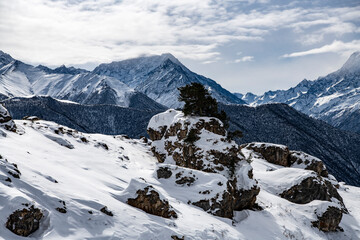 panoramic views of the snow-capped white mountains and bright blue sky 
