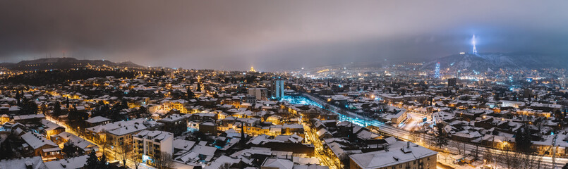 Fototapeta na wymiar Snowy city night panorama