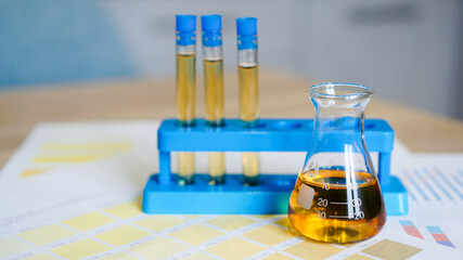 Flask and test tubes at the stand with urine on medical color schemes. The concept of laboratory analyzes, ph control.
