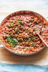 Bolognese beef sauce with tomatoes and parsley 
