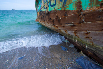The wreck of a fishing boat landed on the shore, Koh Si Chang, Chonburi, Thailand