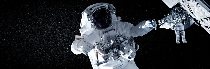 Astronaut spaceman do spacewalk while working for space station in outer space . Astronaut wear full spacesuit for space operation . Elements of this image furnished by NASA space astronaut photos. © InfiniteFlow
