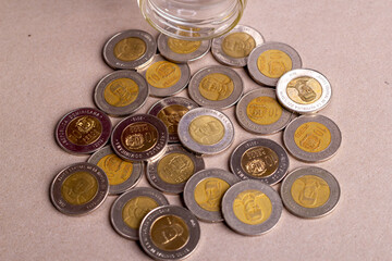 Top view dominican money in a glass jar