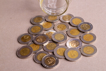 Top view dominican money in a glass jar