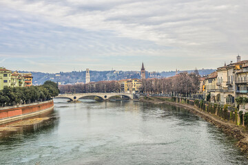 Naklejka premium Beautiful panorama of Adige River waterfront in Verona, Italy.