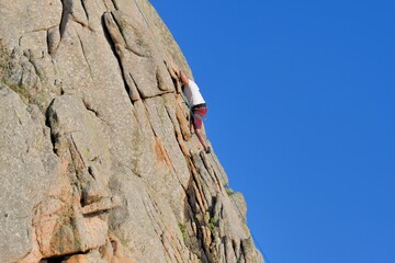 Climbing on a rock in Brittany. France