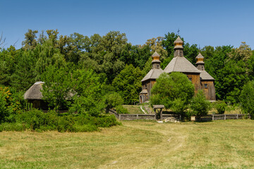 Old wooden church on a background of blue sky