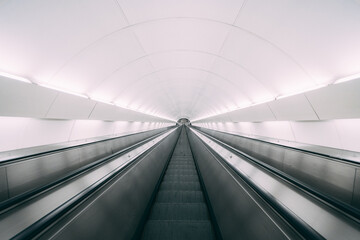 fast white moving escalator