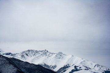Fototapeta na wymiar panoramic landscape of mountains and gorges in winter after snowfall in the Caucasus 