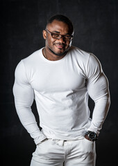 young African American man in studio in glasses