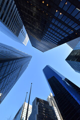Fototapeta na wymiar Worm's-eye view architecture and blue background , Lower Manhattan, New York City, USA