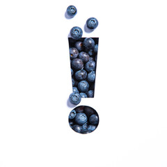 Exclamation mark of blueberries, cut paper isolated on white. Ecofriendly font of bilberries. Warning and keep attention