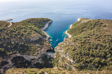 Aerial drone shot of Stiniva cove beach of Adriatic sea on Vis Island in Croatia summer