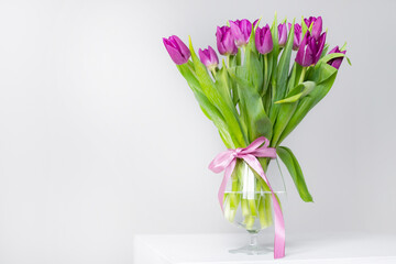 A bouquet of lilac tulips in a vase . Bouquet of tulips. Flowers in a vase. A greeting card. Valentine's day. March 8. Mother's Day. Copy space
