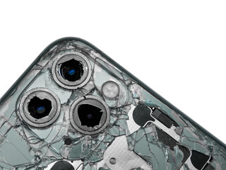 Top view the back of midnight green modern smartphone with a broken glass and a damaged camera close-up isolated on white background