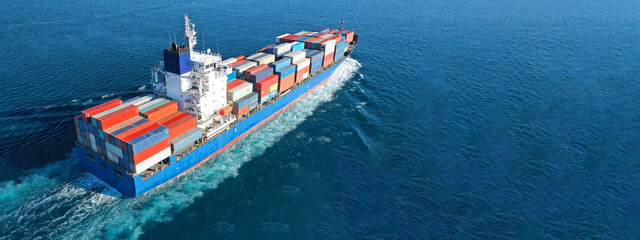Aerial drone ultra wide photo of colourful truck size container tanker ship cruising deep blue sea...