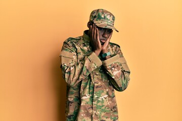 Young african american man wearing army uniform tired hands covering face, depression and sadness, upset and irritated for problem