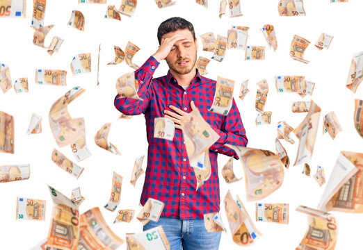 Handsome young man with bear wearing casual shirt touching forehead for illness and fever, flu and cold, virus sick