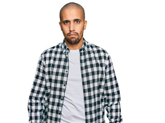 Fototapeta premium Hispanic adult man wearing casual clothes skeptic and nervous, frowning upset because of problem. negative person.