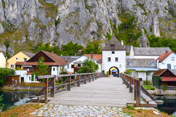 wooden bridge leading to the houses on the background of the mountains. City of Essen Germany