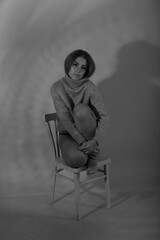 Black and white portrait of young woman with shadows