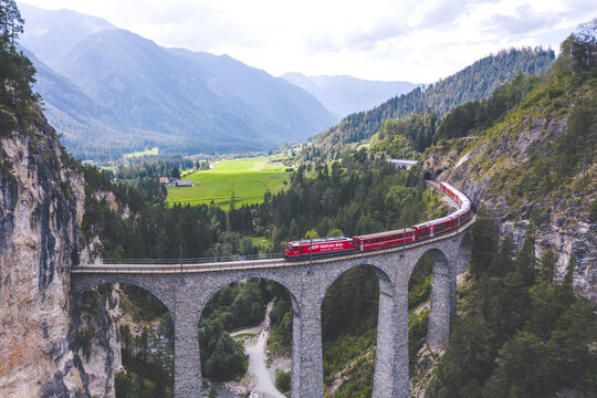 Train passing the Landwasserviadukt in Filisur, Switzerland. September 2020