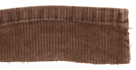 Brown cotton traditional corduroy retail, with tattered around, against white background
