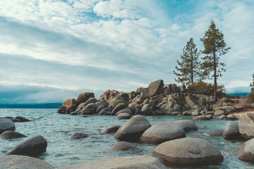 Fototapeta na wymiar Rock formations sticking out of the lake in South Lake Tahoe, Nevada - Wide