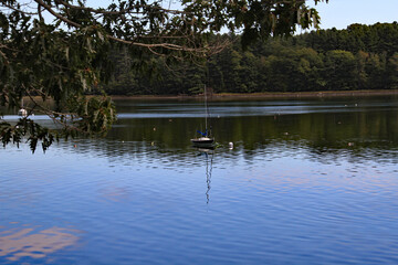 Sailboat anchored in Maine lake