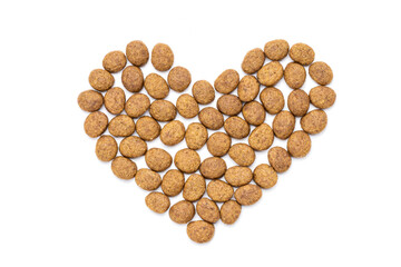 domestic animals dry food isolated on white background. dry cat feed cut out. above view. heart symbol
