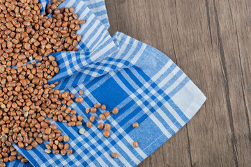 Raw brown kidney beans on a wooden table