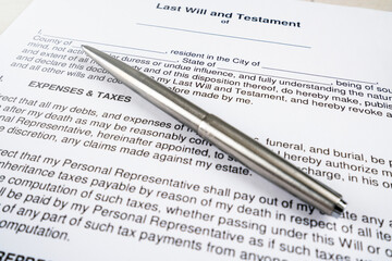 Last will and testament document with pen on top.