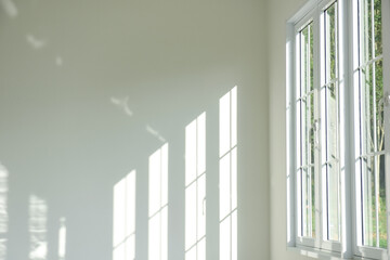 A white room, glass windows, combined with the sun lights.