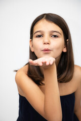 Girl, schoolgirl expresses emotions, indicates the direction close-up on a white background