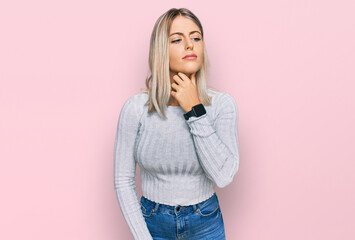 Beautiful blonde woman wearing casual clothes touching painful neck, sore throat for flu, clod and infection
